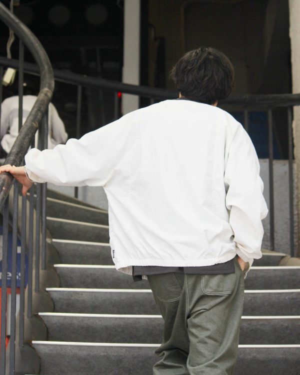 AXESQUINの機能美と日常をつなぐカーディガン